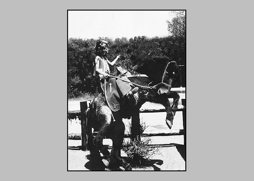 Adrienne riding a bucking horse
