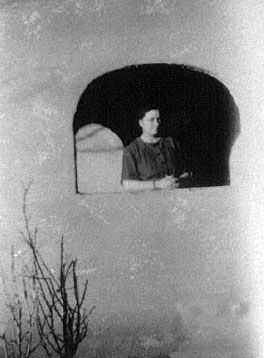<johnie viola turner stand on front porch of ft sumner, nm house>