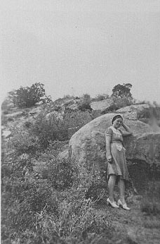 <johnie posed by large rock in the breaks of the ramon ranch>