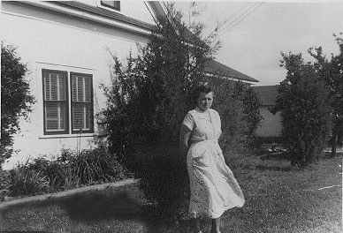 <johnie turner standing in yard of portales house>