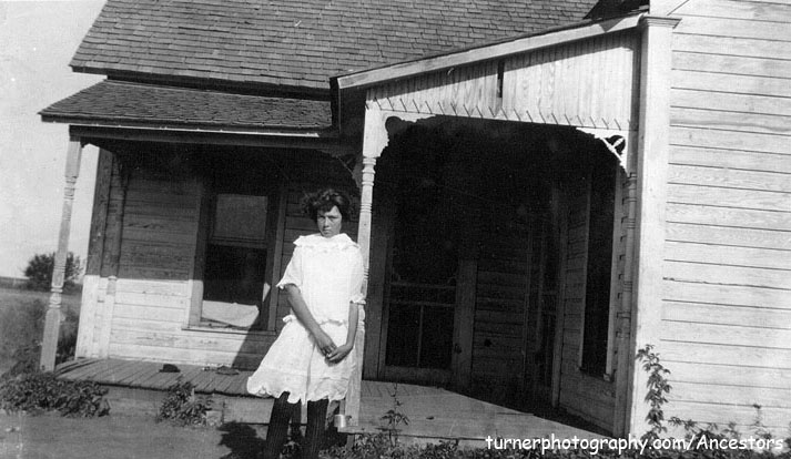 <eddy may downer rombold standing in front of downer house texola, OK>