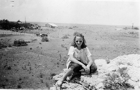 <Carol Lynn Merritt sitting on the bluf on loco draw great view>