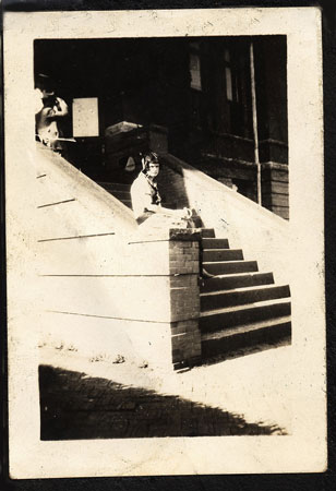 <lady sitting on concrete steps>