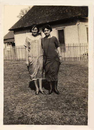 <two ladies dressed bor church>