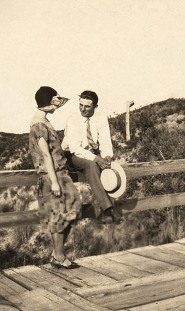 <johnie and friend on wooden bridge>