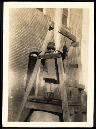<Little Girl standing on the cistern>