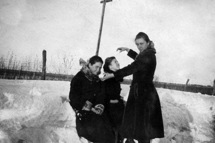 <three girls in snow bank may be eddie may downer on right>