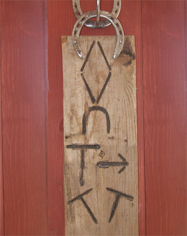 <cattle brands burned on wood by ben taylor>