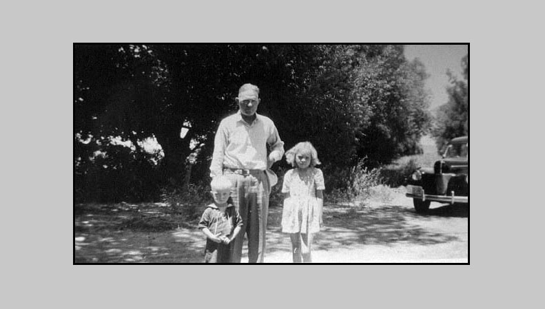 <Terry, wearing his sailor suit, Adron and Adrienne. Unknown location>