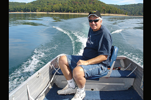 <alan taylor on lake in boat>