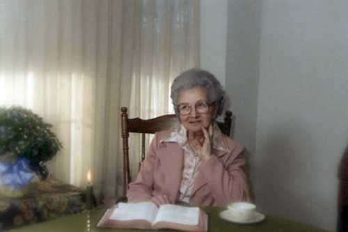 <mother with adron's funeral flowers bible coffee cup favorite photo>