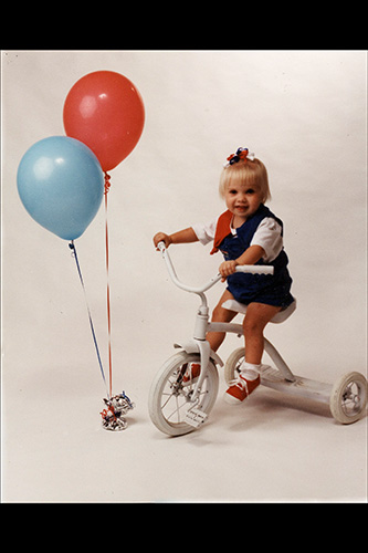 <baloons white tricycle>