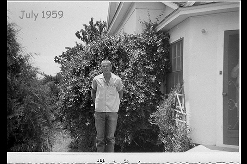 terry standing by front door of portales home