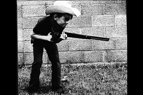 <cowboy ron with gun>