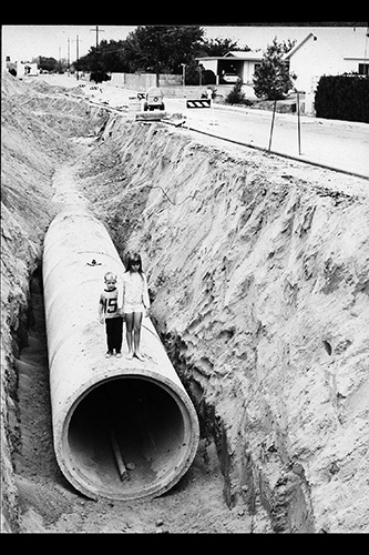 <drainage ditch on locust street large pipe>
