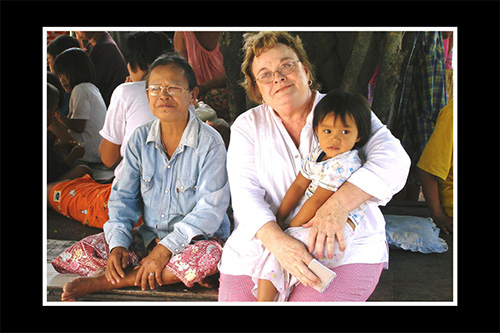 <thialand mission trip janell holding child>