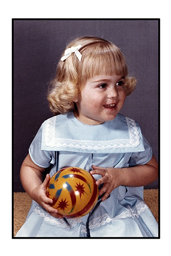 <blue dress yellow ball studio portrait>