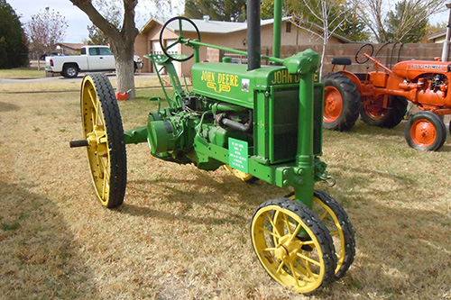 <neighbor's antique john deere tractor>