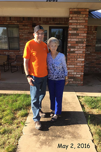 terry and adrienne say good bye on front porch portales nm